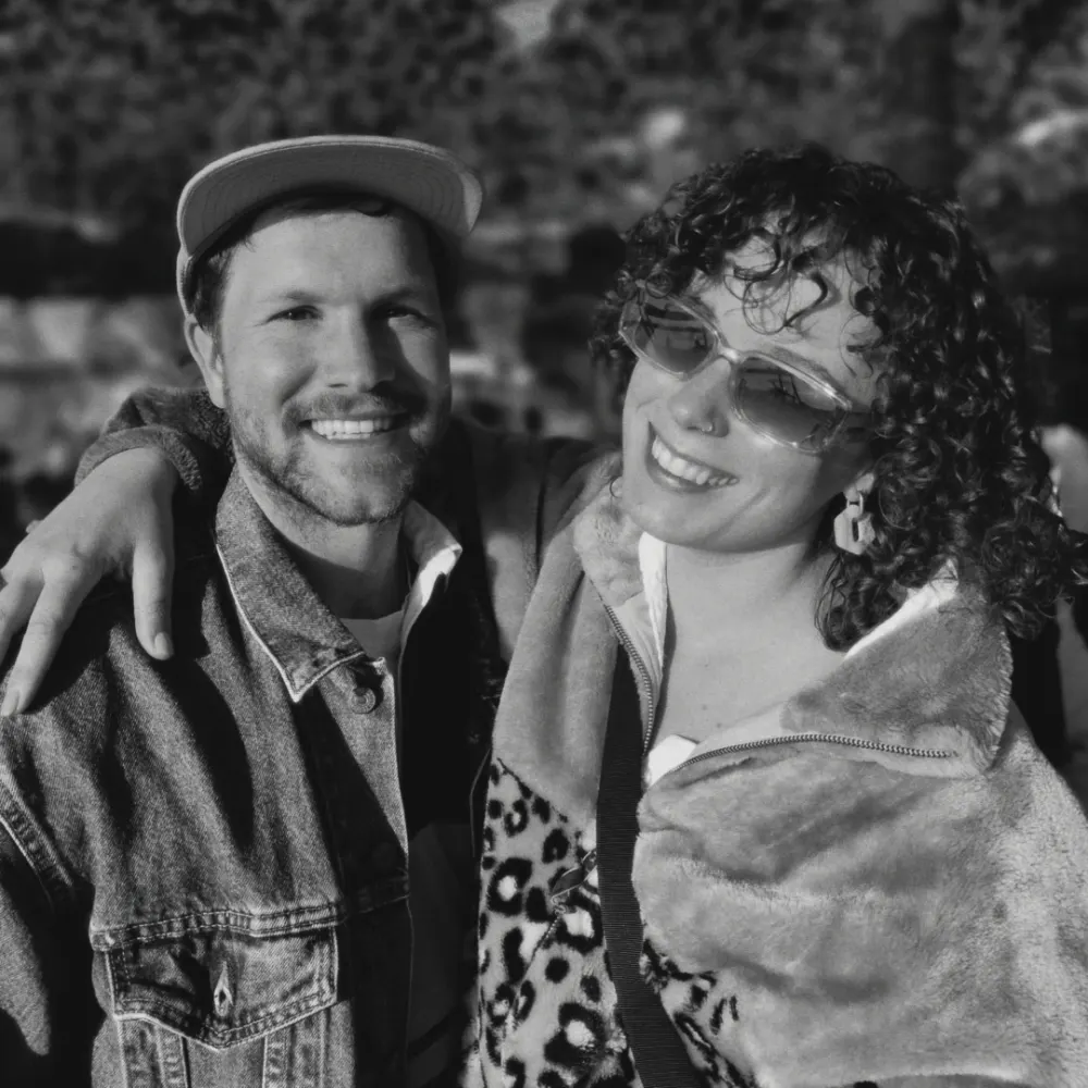 Timo and Kay, arm in arm and laughing